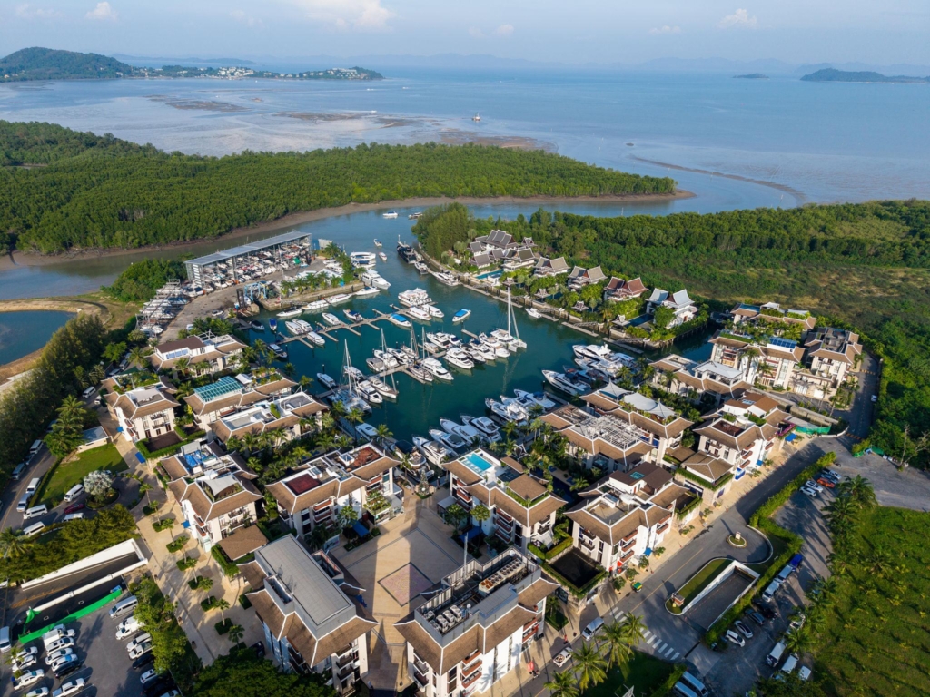 "Luxury property investment in Phuket overlooking Bang Tao Beach." "Thailand property investment comparison featuring Phuket, Bangkok, Pattaya, Hua Hin, Koh Samui, Krabi and Chiang Mai." "Luxury villas and marina lifestyle in Phuket's Bang Tao and Laguna area."