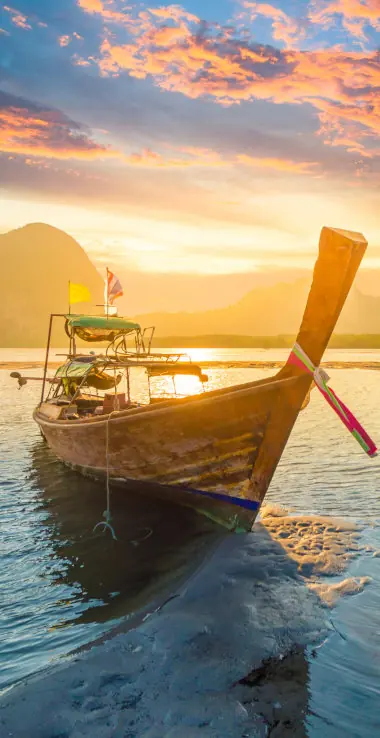 Longtail boat on the beach at sunset, Phuket